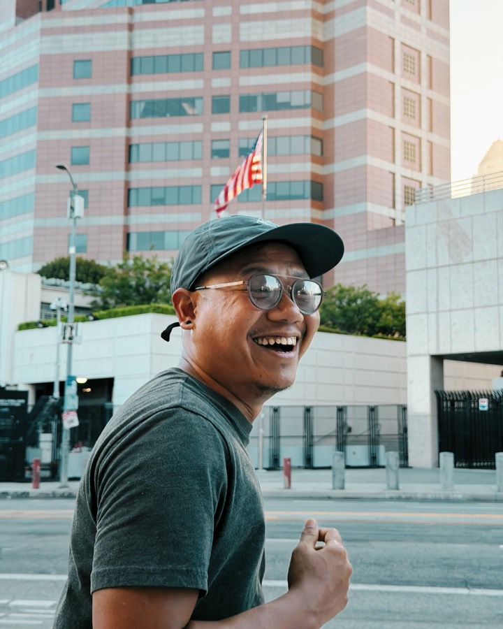 Laughing mid-run on a downtown Los Angeles street
